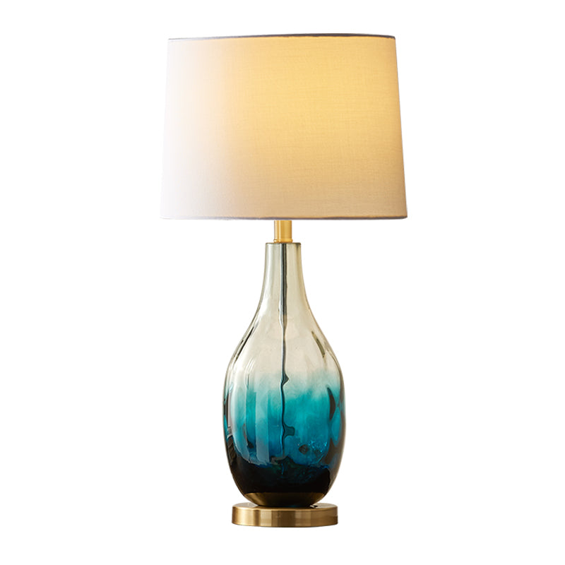 Beige/Brown 1 Head Nightstand Lamp Contemporary Fabric Drum Table Lighting with Jar Fading Blue Glass Base Clearhalo 'Lamps' 'Table Lamps' Lighting' 1136554