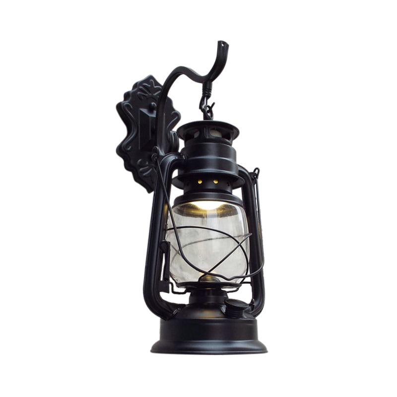 Clear Glass Black/Antique Brass Wall Sconce Lighting Lantern 1-Light Coastal Light Fixture for Porch Black Clearhalo 'Art deco wall lights' 'Cast Iron' 'Glass' 'Industrial wall lights' 'Industrial' 'Middle century wall lights' 'Modern' 'Rustic wall lights' 'Tiffany' 'Traditional wall lights' 'Wall Lamps & Sconces' 'Wall Lights' Lighting' 138772