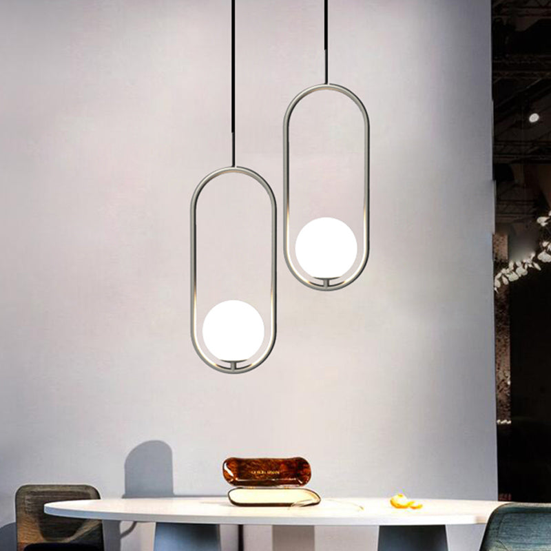 Chrome Oblong Suspension Pendant Minimalism 1-Light Iron Hanging Light with Orb White Glass Shade Clearhalo 'Ceiling Lights' 'Glass shade' 'Glass' 'Modern Pendants' 'Modern' 'Pendant Lights' 'Pendants' Lighting' 1454918