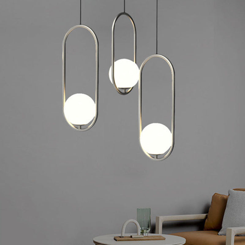 Chrome Oblong Suspension Pendant Minimalism 1-Light Iron Hanging Light with Orb White Glass Shade Clearhalo 'Ceiling Lights' 'Glass shade' 'Glass' 'Modern Pendants' 'Modern' 'Pendant Lights' 'Pendants' Lighting' 1454919