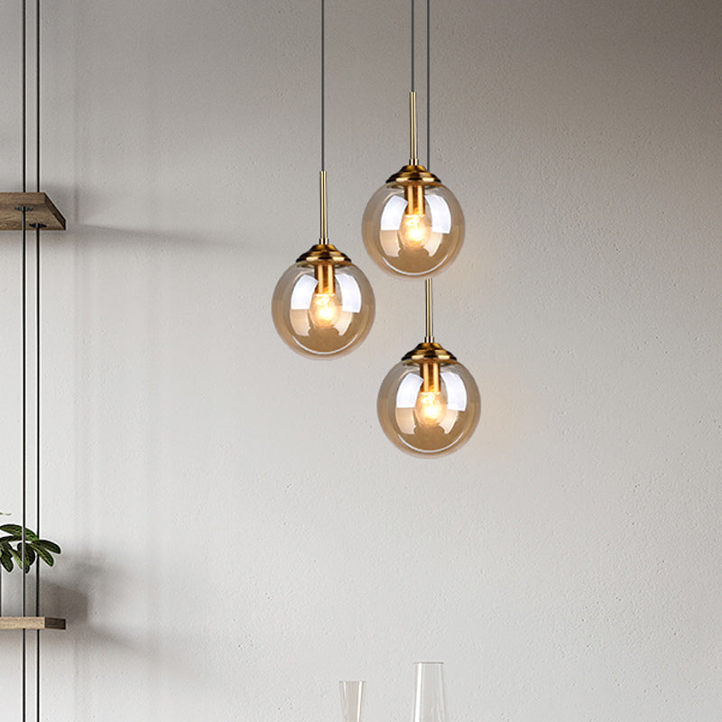 1-Light Dining Room Ceiling Pendant Simple Brass Hanging Lamp with Spherical Amber/Smoke Glass Shade Clearhalo 'Ceiling Lights' 'Close To Ceiling Lights' 'Glass shade' 'Glass' 'Modern Pendants' 'Modern' 'Pendant Lights' 'Pendants' Lighting' 1455021