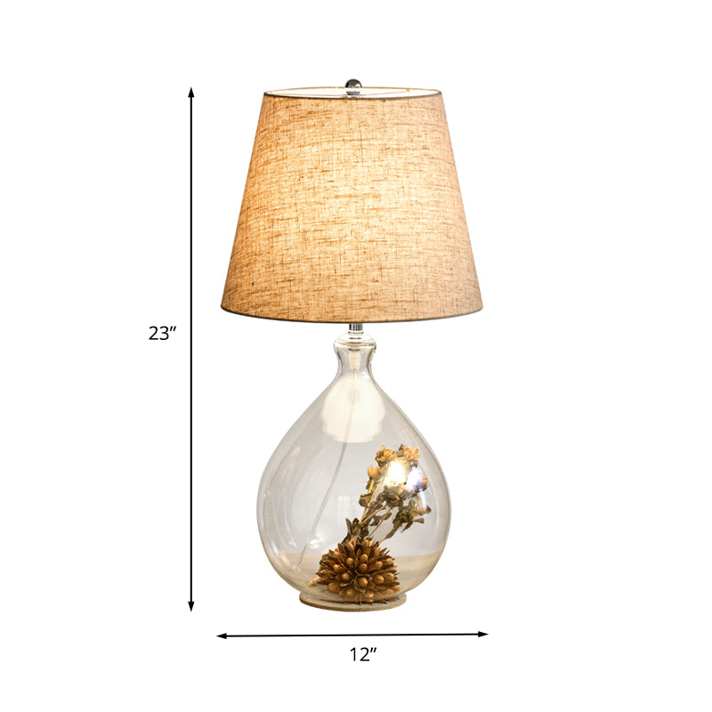 Modern 1 Head Table Light Clear Waterdrop/Bottle Glass Night Lighting with Dried Flower Decor and Flaxen Fabric Shade Clearhalo 'Lamps' 'Table Lamps' Lighting' 1460081