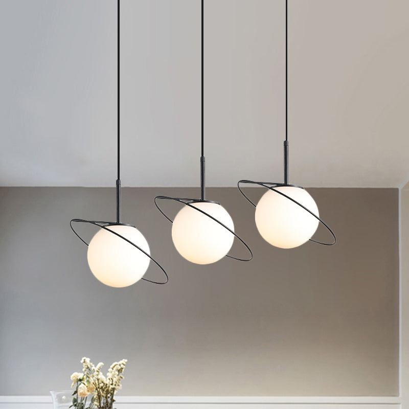 Opal Matte Glass Planet Multi-Light Pendant Postmodern 3 Bulbs Black Hanging Lamp Kit over Dining Table Black Clearhalo 'Ceiling Lights' 'Glass shade' 'Glass' 'Modern Pendants' 'Modern' 'Pendant Lights' 'Pendants' Lighting' 1475995