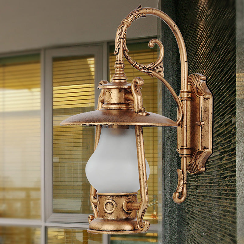 Lantern Frosted Glass Wall Mounted Lamp Coastal Single Bulb Outdoor Sconce Light in Black/Aged Brass Brass Clearhalo 'Art deco wall lights' 'Cast Iron' 'Glass' 'Industrial wall lights' 'Industrial' 'Middle century wall lights' 'Modern' 'Rustic wall lights' 'Tiffany' 'Traditional wall lights' 'Wall Lamps & Sconces' 'Wall Lights' Lighting' 151006