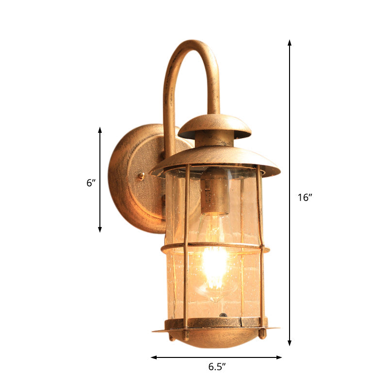 1 Light Wall Lamp Lighting Coastal Cylinder Clear Glass Sconce Light Fixture in Brass with Cage Clearhalo 'Art deco wall lights' 'Cast Iron' 'Glass' 'Industrial wall lights' 'Industrial' 'Middle century wall lights' 'Modern' 'Rustic wall lights' 'Tiffany' 'Traditional wall lights' 'Wall Lamps & Sconces' 'Wall Lights' Lighting' 192383