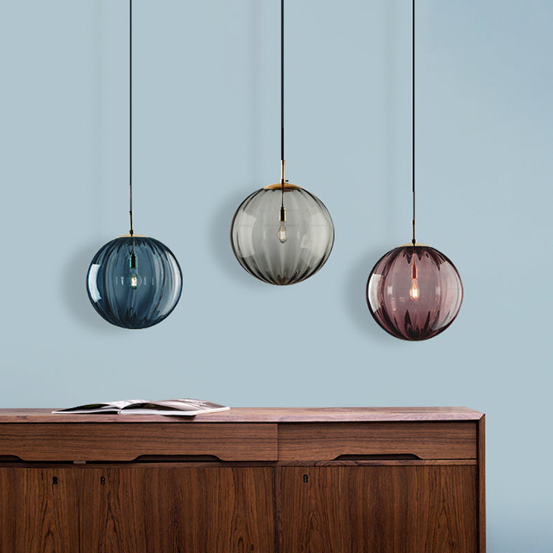 Globe Bedside Pendulum Light Blue/Smoke Grey/Purple Glass 1 Bulb Postmodern Ceiling Pendant Lamp in Black Clearhalo 'Ceiling Lights' 'Glass shade' 'Glass' 'Modern Pendants' 'Modern' 'Pendant Lights' 'Pendants' Lighting' 1937128