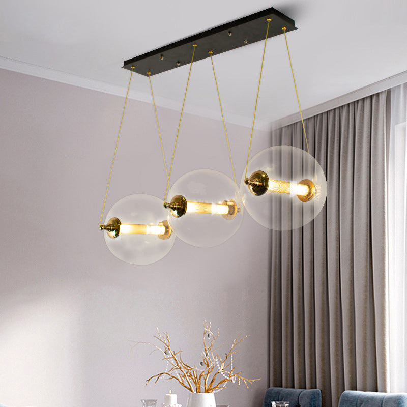 Gold Globe Ceiling Pendant Light Modern 1/3-Head Clear Glass Suspension Lighting with Mesh Tube Inside 3 Clear Clearhalo 'Ceiling Lights' 'Close To Ceiling Lights' 'Glass shade' 'Glass' 'Modern Pendants' 'Modern' 'Pendant Lights' 'Pendants' Lighting' 1937621