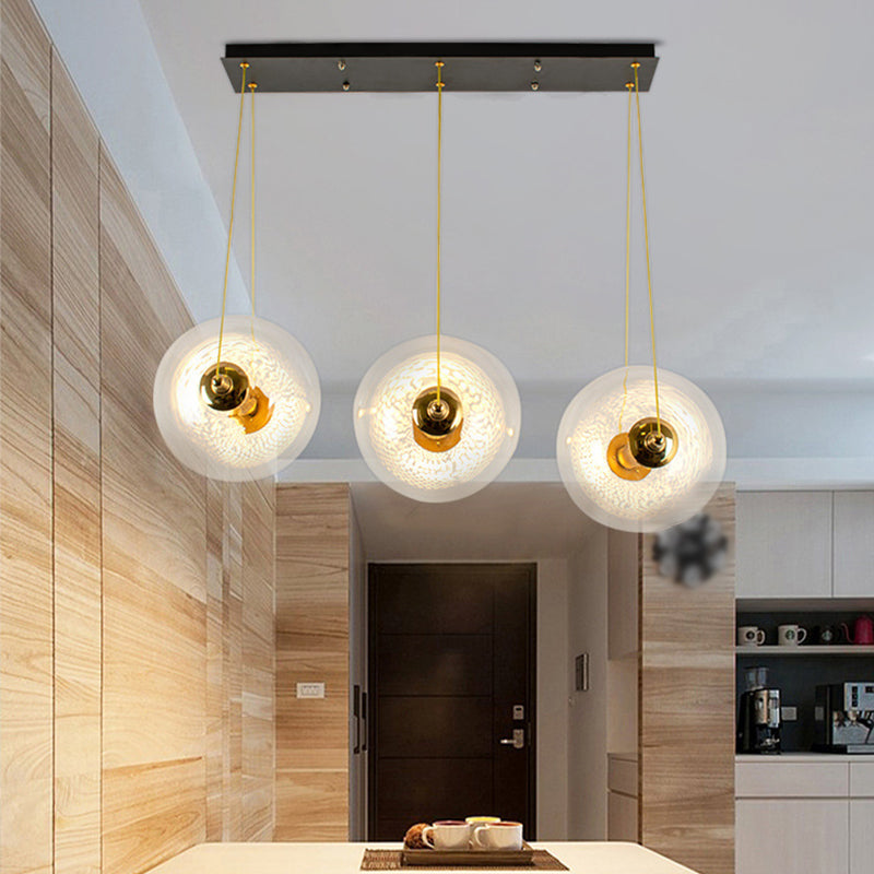 Gold Globe Ceiling Pendant Light Modern 1/3-Head Clear Glass Suspension Lighting with Mesh Tube Inside Clearhalo 'Ceiling Lights' 'Close To Ceiling Lights' 'Glass shade' 'Glass' 'Modern Pendants' 'Modern' 'Pendant Lights' 'Pendants' Lighting' 1937622