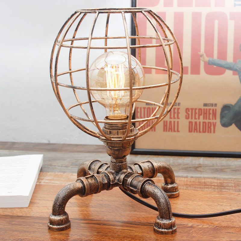 Metal Ball Cage Table Lamp with Pipe-Like Base Industrial Style 1 Bulb Bedroom Mini Table Light in Antique Bronze Clearhalo 'Lamps' 'Table Lamps' Lighting' 195914