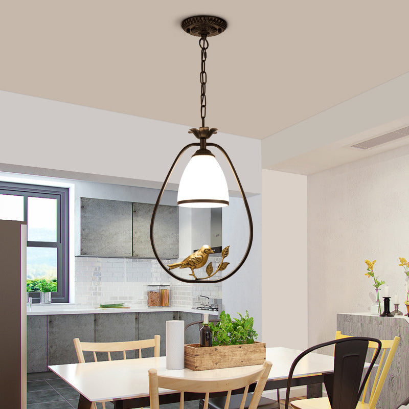 Rustic Oval/Round Pendulum Light 1 Bulb Metal Pendant Lamp in Black with Bell White Glass Shade and Bird Decoration Clearhalo 'Ceiling Lights' 'Pendant Lights' 'Pendants' Lighting' 1972262