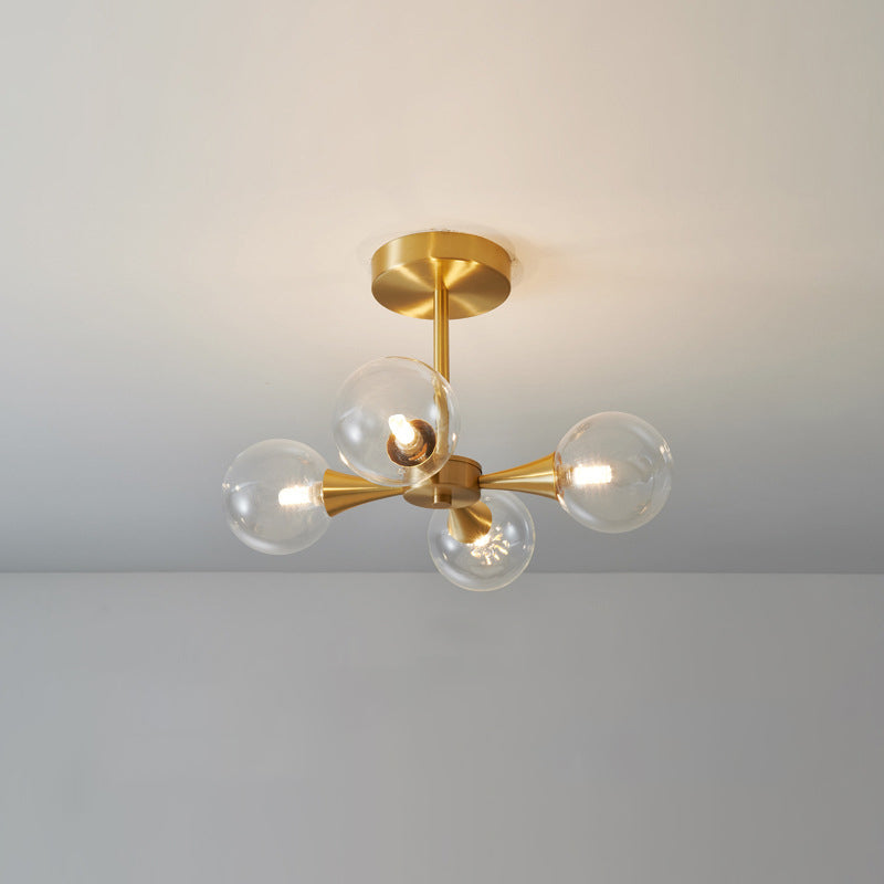 Brass Globe Semi Flush Light Minimalist Glass LED Close to Ceiling Lamp for Bedroom 4 Brass Clear Clearhalo 'Ceiling Lights' 'Close To Ceiling Lights' 'Close to ceiling' 'Glass shade' 'Glass' 'Semi-flushmount' Lighting' 2039243