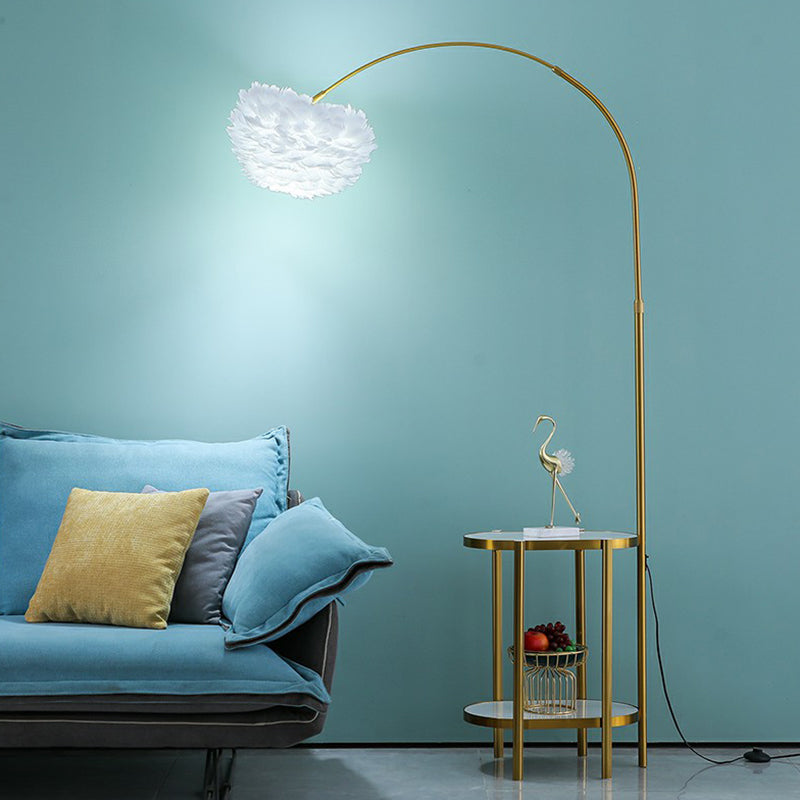 Arc Arm Standing Light Modern Metallic 1-Light Living Room Floor Lighting with Feather Shade and 2-Tier Shelf Gold Oval Clearhalo 'Floor Lamps' 'Lamps' Lighting' 2196988