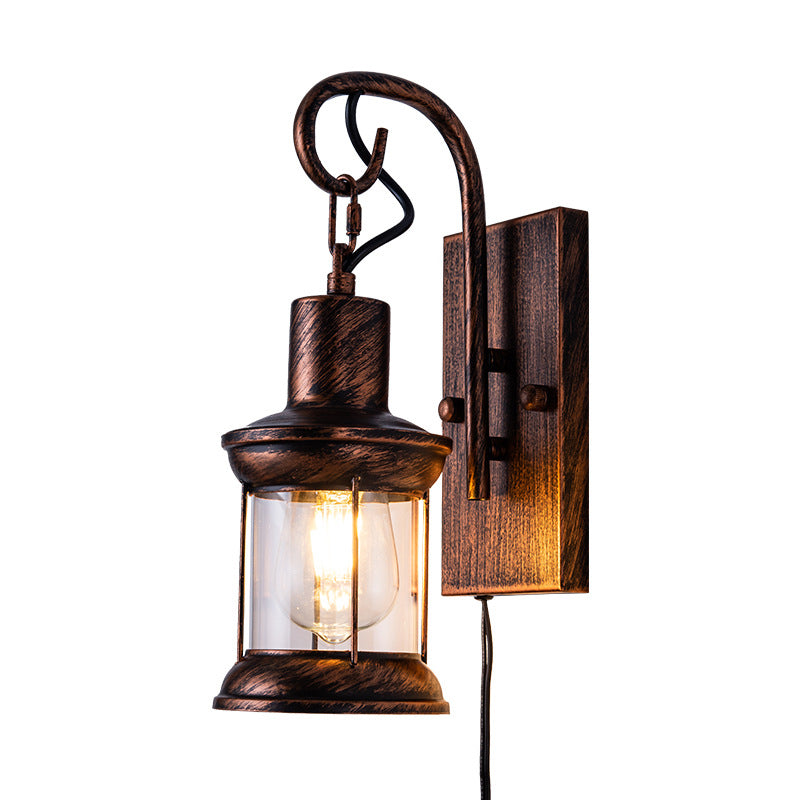 Iron Lantern Wall Light Retro Style Single-Bulb Restaurant Wall Lighting Fixture in Bronze Clearhalo 'Art deco wall lights' 'Cast Iron' 'Glass' 'Industrial wall lights' 'Industrial' 'Middle century wall lights' 'Modern' 'Rustic wall lights' 'Tiffany' 'Traditional wall lights' 'Wall Lamps & Sconces' 'Wall Lights' Lighting' 2216674