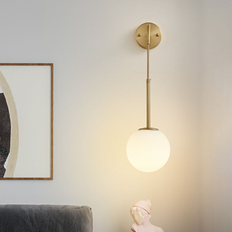 Gold Finish Mini Globe Wall Light Sconce Minimalism 1-Bulb Cream Glass Wall Lighting Clearhalo 'Cast Iron' 'Glass' 'Industrial' 'Modern wall lights' 'Modern' 'Tiffany' 'Traditional wall lights' 'Wall Lamps & Sconces' 'Wall Lights' Lighting' 2254368