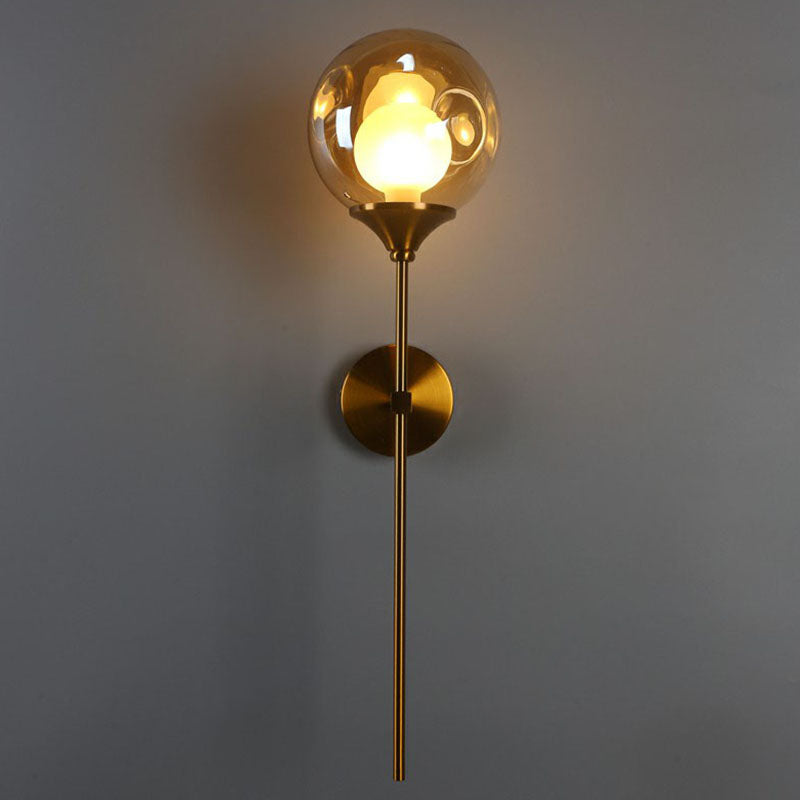 Nordic Ball Shaped Wall Light Glass 1-Bulb Entryway Sconce Lighting with Brass Pencil Arm Amber Clearhalo 'Cast Iron' 'Glass' 'Industrial' 'Modern wall lights' 'Modern' 'Tiffany' 'Traditional wall lights' 'Wall Lamps & Sconces' 'Wall Lights' Lighting' 2254486