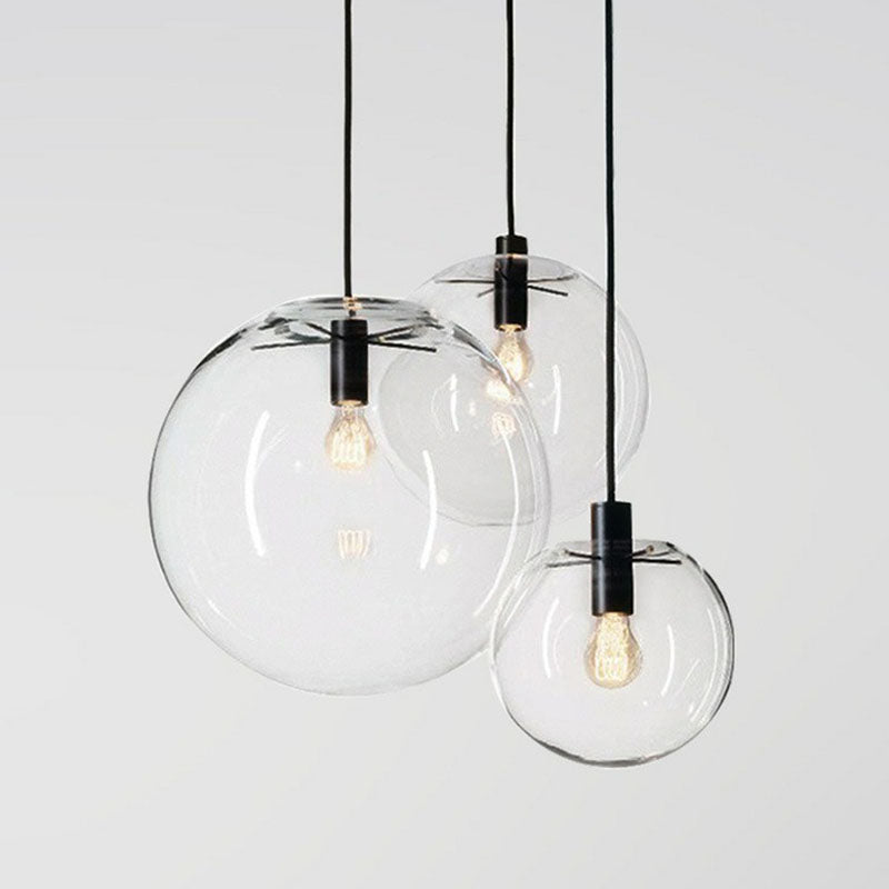 Clear Glass Globe Hanging Light Minimalistic 1-Light Black Pendant Lighting for Restaurant Clearhalo 'Ceiling Lights' 'Modern Pendants' 'Modern' 'Pendant Lights' 'Pendants' Lighting' 2254750