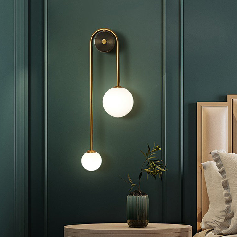 Brass Arc Wall Lighting Postmodern 2-Head Metal Sconce Light with Ball Opal Glass Shade Brass Clearhalo 'Cast Iron' 'Glass' 'Industrial' 'Modern wall lights' 'Modern' 'Tiffany' 'Traditional wall lights' 'Wall Lamps & Sconces' 'Wall Lights' Lighting' 2353447