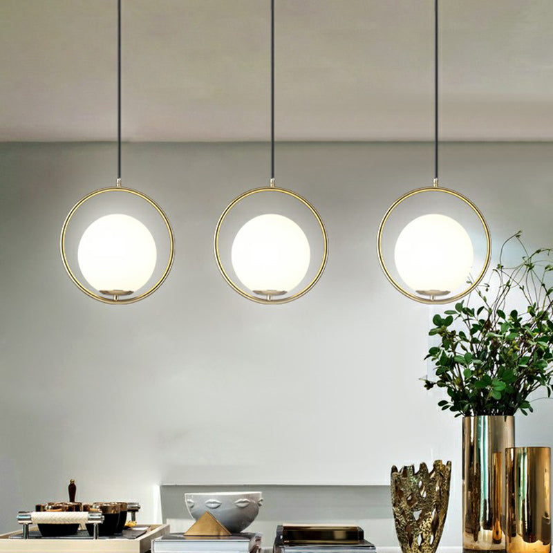 Globe Dining Room Suspension Lamp Milky Glass 1 Bulb Modern Pendant Light with Brass Loop Clearhalo 'Ceiling Lights' 'Modern Pendants' 'Modern' 'Pendant Lights' 'Pendants' Lighting' 2353911