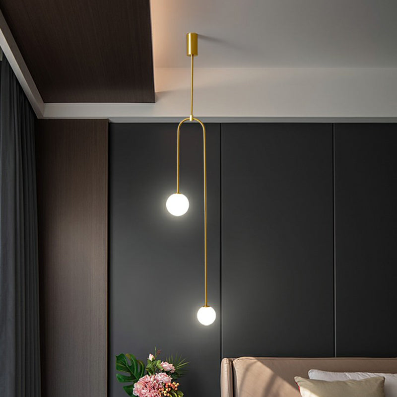 Minimalistic Orbs Pendant Ceiling Light Opal Glass 2-Light Bedside Chandelier in Brass Brass Clearhalo 'Ceiling Lights' 'Chandeliers' 'Modern Chandeliers' 'Modern' Lighting' 2354213