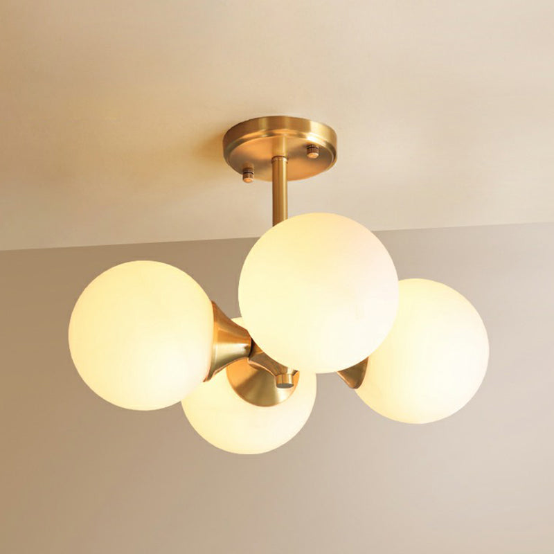 Brass Globe Flush Mount Lighting Postmodern 4 Heads Opal Glass Semi Flush Light for Bedroom Brass Clearhalo 'Ceiling Lights' 'Chandeliers' 'Modern Chandeliers' 'Modern' Lighting' 2354233