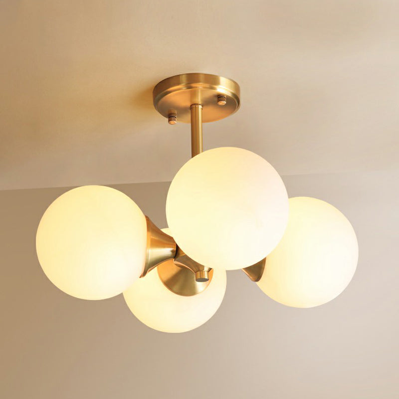 Brass Globe Flush Mount Lighting Postmodern 4 Heads Opal Glass Semi Flush Light for Bedroom Clearhalo 'Ceiling Lights' 'Chandeliers' 'Modern Chandeliers' 'Modern' Lighting' 2354236