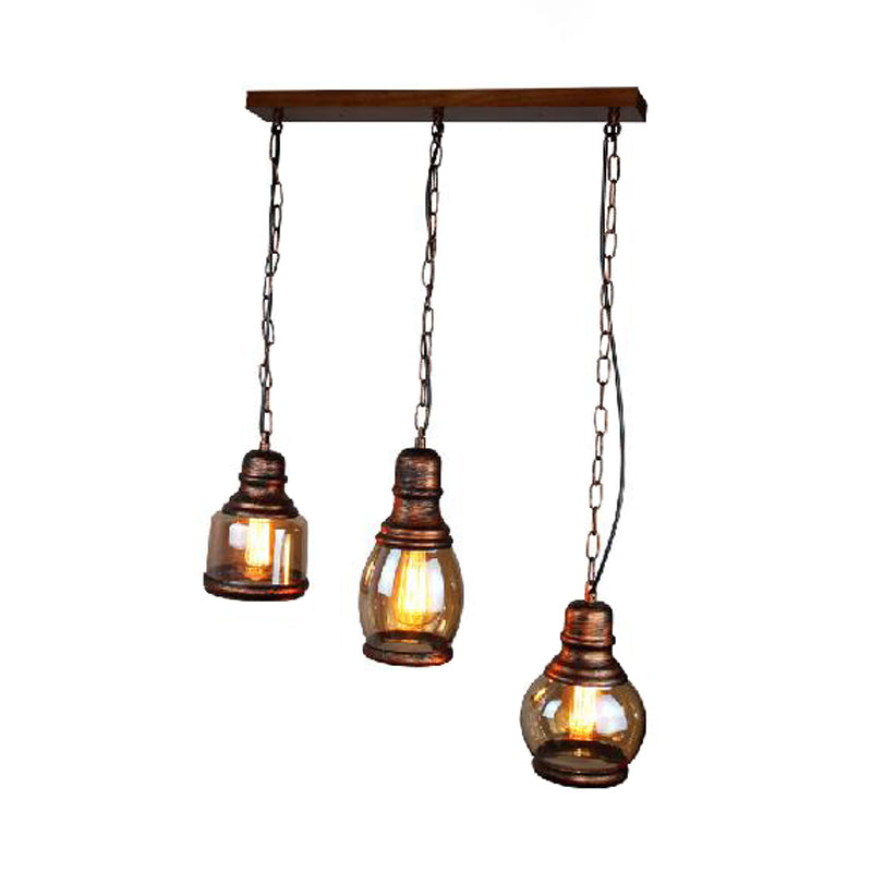 Rust Bottle Shade Multi Pendant Rustic Clear Glass 1 Light Coffee Shop Hanging Ceiling Light with Linear Canopy Clearhalo 'Art Deco Pendants' 'Cast Iron' 'Ceiling Lights' 'Ceramic' 'Crystal' 'Industrial Pendants' 'Industrial' 'Metal' 'Middle Century Pendants' 'Pendant Lights' 'Pendants' 'Tiffany' Lighting' 235500