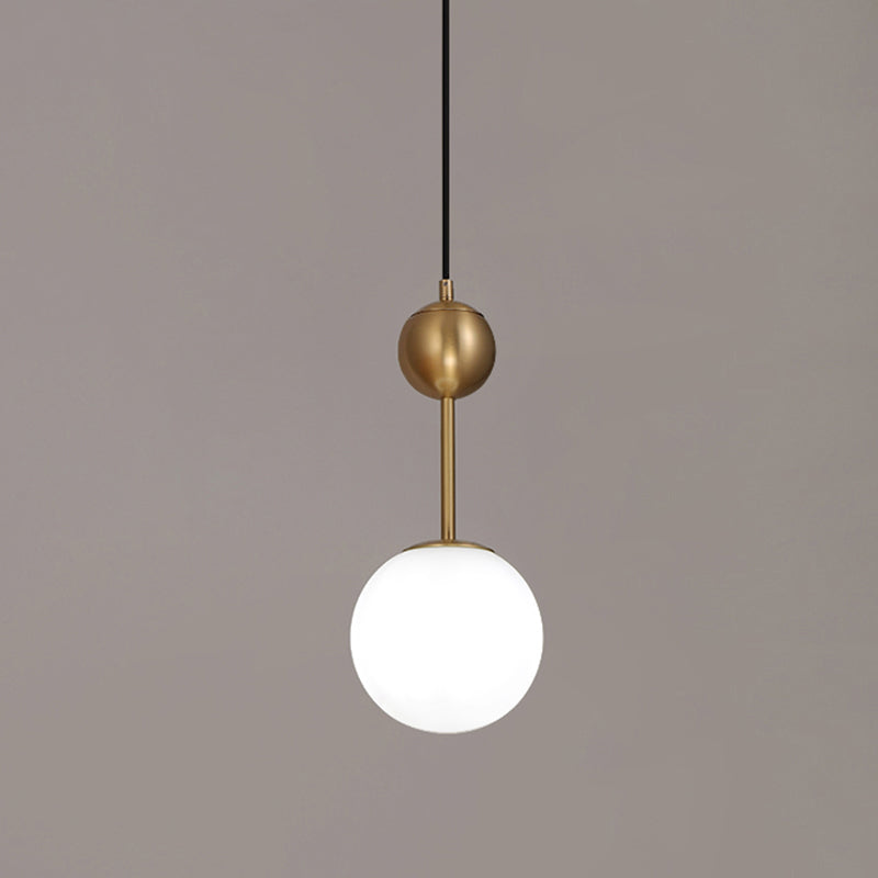 Ball Bedside Hanging Light Opaline Glass 1-Light Minimalist Suspension Pendant in Brass Clearhalo 'Ceiling Lights' 'Modern Pendants' 'Modern' 'Pendant Lights' 'Pendants' Lighting' 2356927