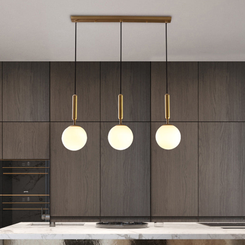 Brass Ball Multiple Hanging Pendant Light Simplicity Glass Ceiling Light for Open Kitchen 3 White Clearhalo 'Ceiling Lights' 'Modern Pendants' 'Modern' 'Pendant Lights' 'Pendants' Lighting' 2357025