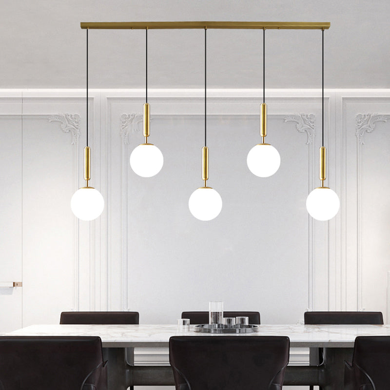 Brass Ball Multiple Hanging Pendant Light Simplicity Glass Ceiling Light for Open Kitchen 5 White Clearhalo 'Ceiling Lights' 'Modern Pendants' 'Modern' 'Pendant Lights' 'Pendants' Lighting' 2357027