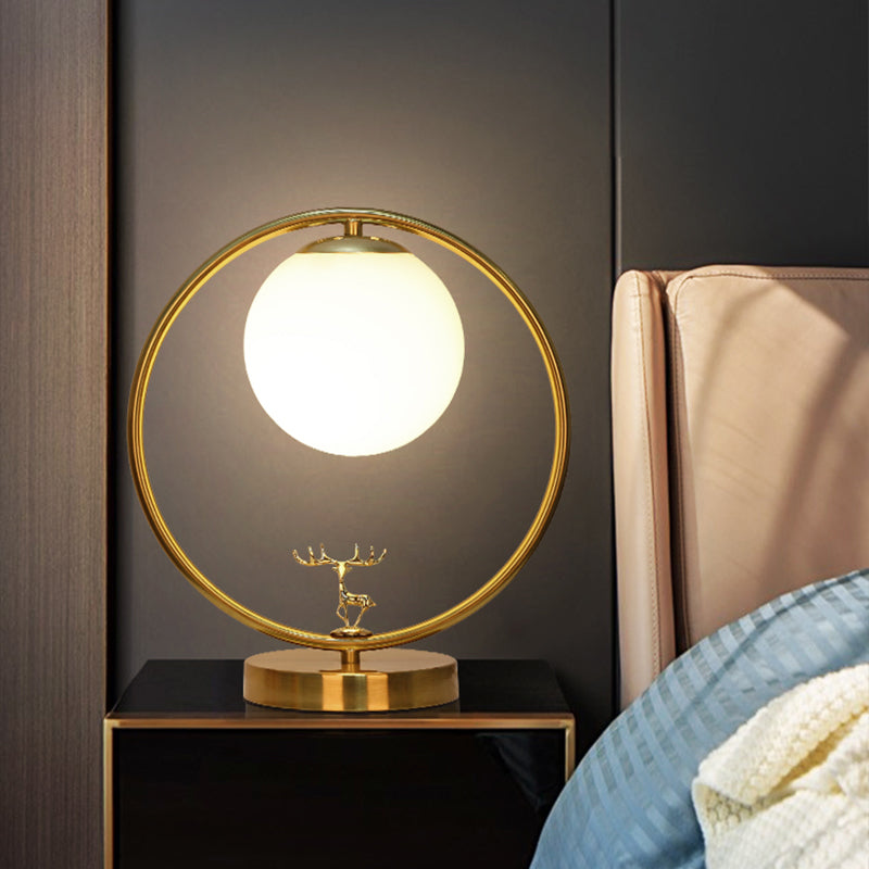 Ivory Glass Ball Table Light Simple Style 1-Light Gold Night Lamp with Metal Ring and Deer Deco Gold Clearhalo 'Lamps' 'Table Lamps' Lighting' 2408773