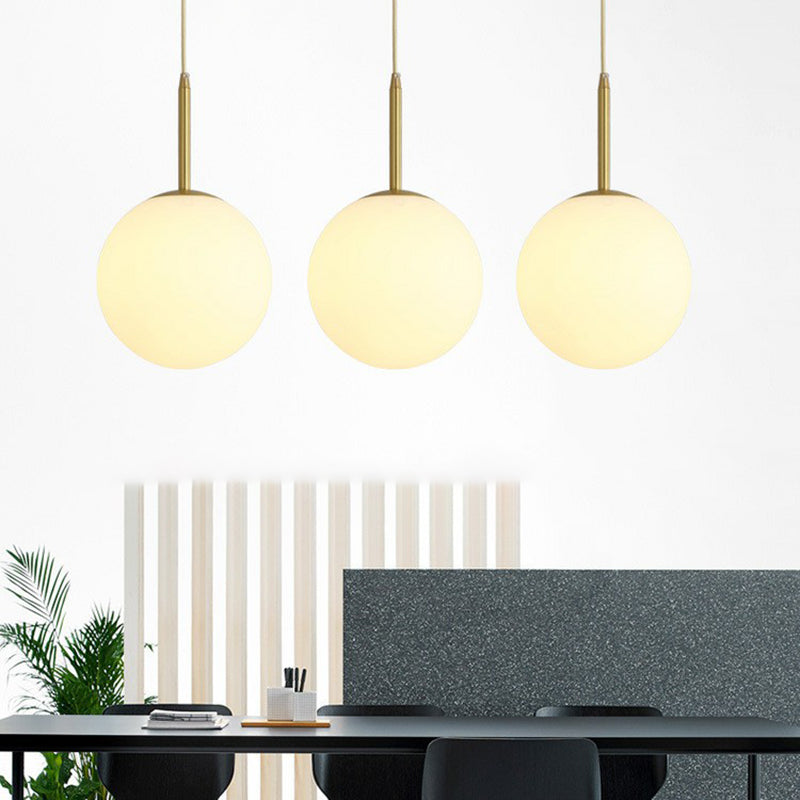 Sphere Opal Glass Multiple Lamp Pendant Minimalism 3-Bulb Gold Pendulum Light for Dining Room Clearhalo 'Ceiling Lights' 'Modern Pendants' 'Modern' 'Pendant Lights' 'Pendants' Lighting' 2423070