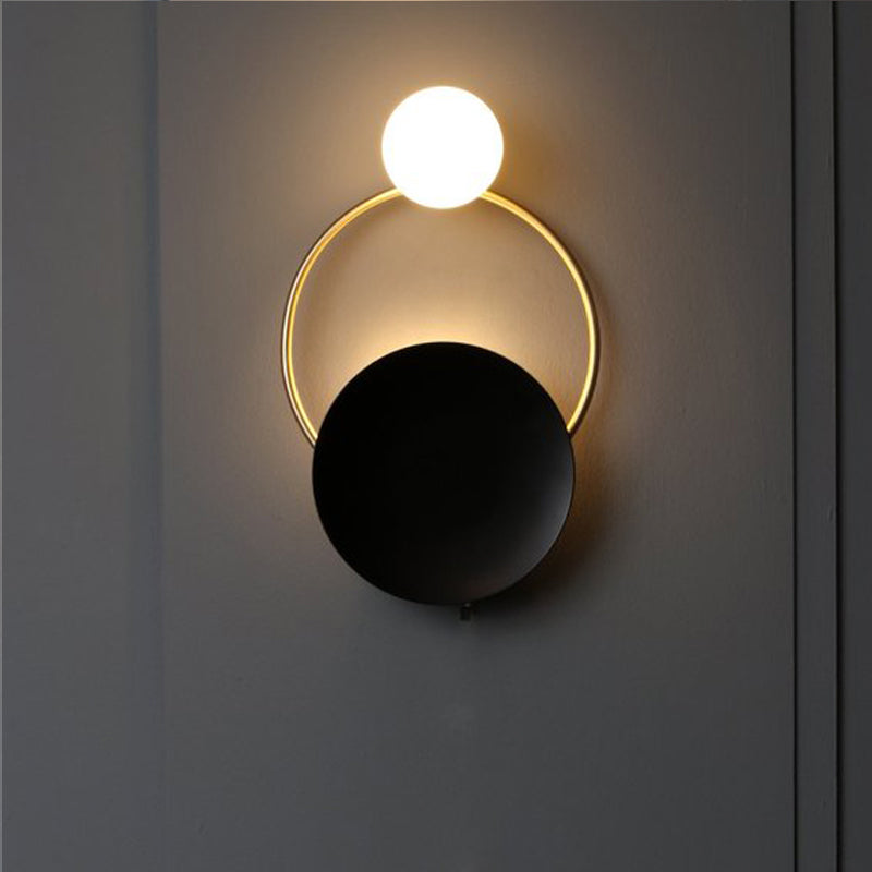 Postmodern Creative Circle Wall Sconce Cream Glass 1 Head Corridor Wall Light in Black-Brass Black Clearhalo 'Cast Iron' 'Glass' 'Industrial' 'Modern wall lights' 'Modern' 'Tiffany' 'Traditional wall lights' 'Wall Lamps & Sconces' 'Wall Lights' Lighting' 2466924