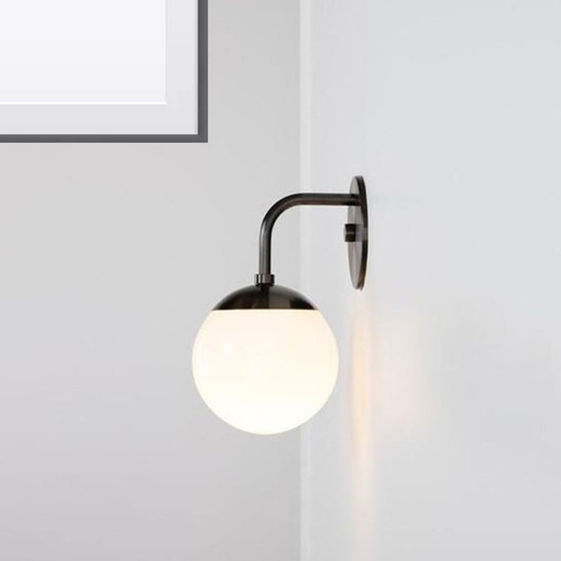 1 Bulb Bedside Sconce Light Minimalist Golden/Black Wall Lamp with Milky Glass Ball Shade Black Clearhalo 'Cast Iron' 'Glass' 'Industrial' 'Modern wall lights' 'Modern' 'Tiffany' 'Traditional wall lights' 'Wall Lamps & Sconces' 'Wall Lights' Lighting' 273228