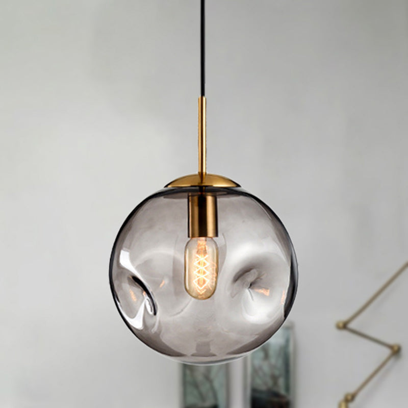 Globe Pendant Light Nordic Amber/Smoke Gray Dimpled Glass 1 Head Dining Room Hanging Ceiling Light Clearhalo 'Ceiling Lights' 'Modern Pendants' 'Modern' 'Pendant Lights' 'Pendants' Lighting' 289052