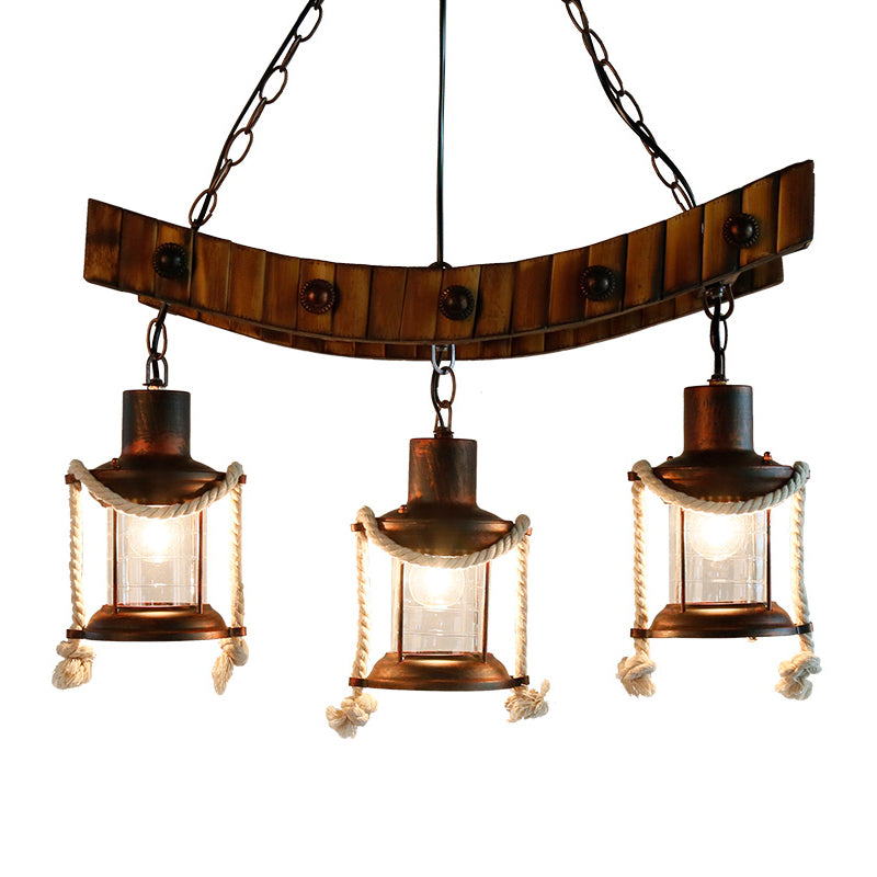 Clear Glass Dark Brown Chandelier Light Lantern 3 Lights Warehouse Hanging Ceiling Fixture for Kitchen Clearhalo 'Ceiling Lights' 'Chandeliers' 'Glass shade' 'Glass' 'Industrial Chandeliers' 'Industrial' 'Middle Century Chandeliers' 'Tiffany' Lighting' 326694