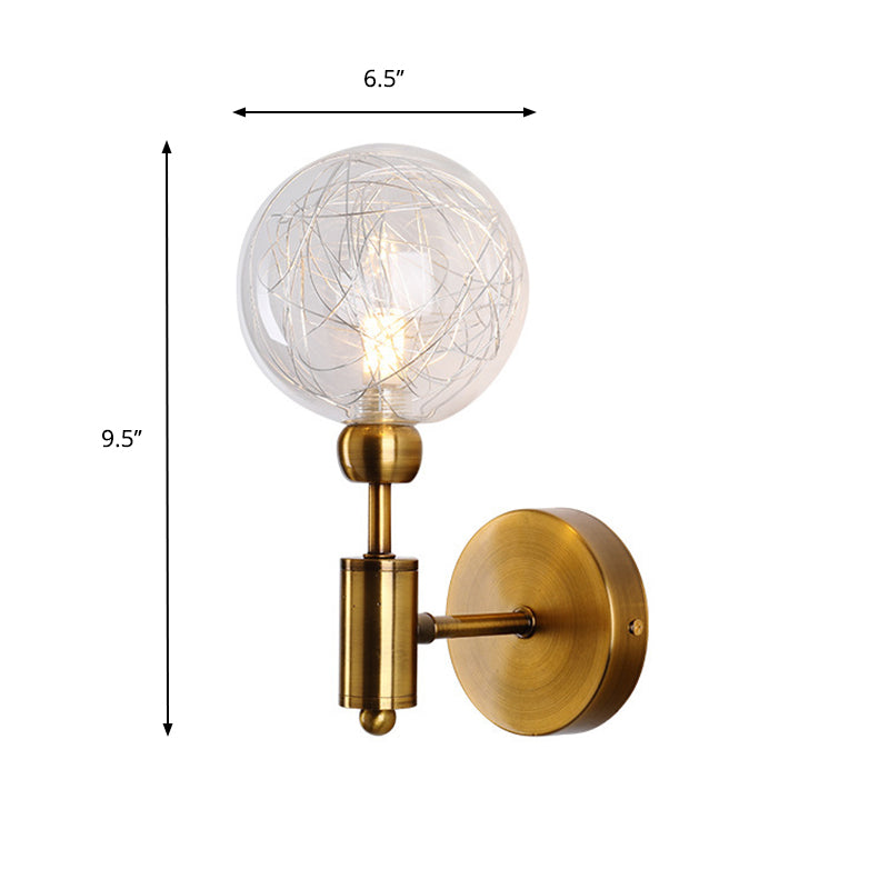 1/2-Light Bedroom Sconce Wall Light Industrial Style Black/Brass Finish Wall Lamp with Orbit Clear Glass Shade Clearhalo 'Art deco wall lights' 'Cast Iron' 'Glass' 'Industrial wall lights' 'Industrial' 'Middle century wall lights' 'Modern' 'Rustic wall lights' 'Tiffany' 'Traditional wall lights' 'Wall Lamps & Sconces' 'Wall Lights' Lighting' 331679