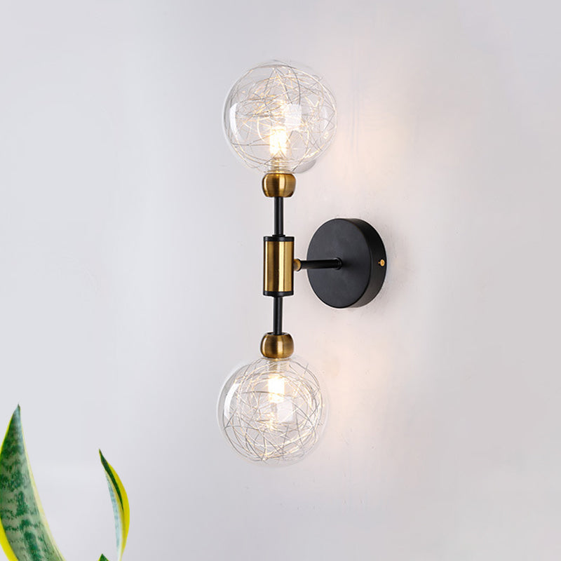 1/2-Light Bedroom Sconce Wall Light Industrial Style Black/Brass Finish Wall Lamp with Orbit Clear Glass Shade 2.0 Black Clearhalo 'Art deco wall lights' 'Cast Iron' 'Glass' 'Industrial wall lights' 'Industrial' 'Middle century wall lights' 'Modern' 'Rustic wall lights' 'Tiffany' 'Traditional wall lights' 'Wall Lamps & Sconces' 'Wall Lights' Lighting' 331684