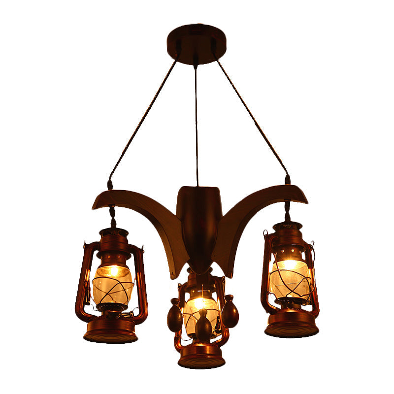 Industrial Kerosene Chandelier Lamp 3 Lights Clear Glass Hanging Ceiling Light in Dark Wood for Living Room Clearhalo 'Ceiling Lights' 'Chandeliers' 'Glass shade' 'Glass' 'Industrial Chandeliers' 'Industrial' 'Middle Century Chandeliers' 'Tiffany' Lighting' 337407