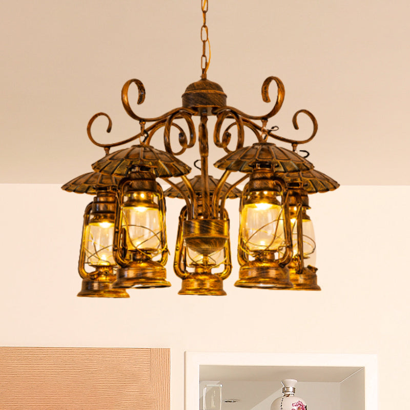 Aged Brass Lantern Suspension Light Village Style Metal and Clear Glass 5 Light Dining Room Chandelier Clearhalo 'Ceiling Lights' 'Chandeliers' 'Close To Ceiling Lights' 'Glass shade' 'Glass' 'Industrial Chandeliers' 'Industrial' 'Middle Century Chandeliers' 'Tiffany' Lighting' 415927