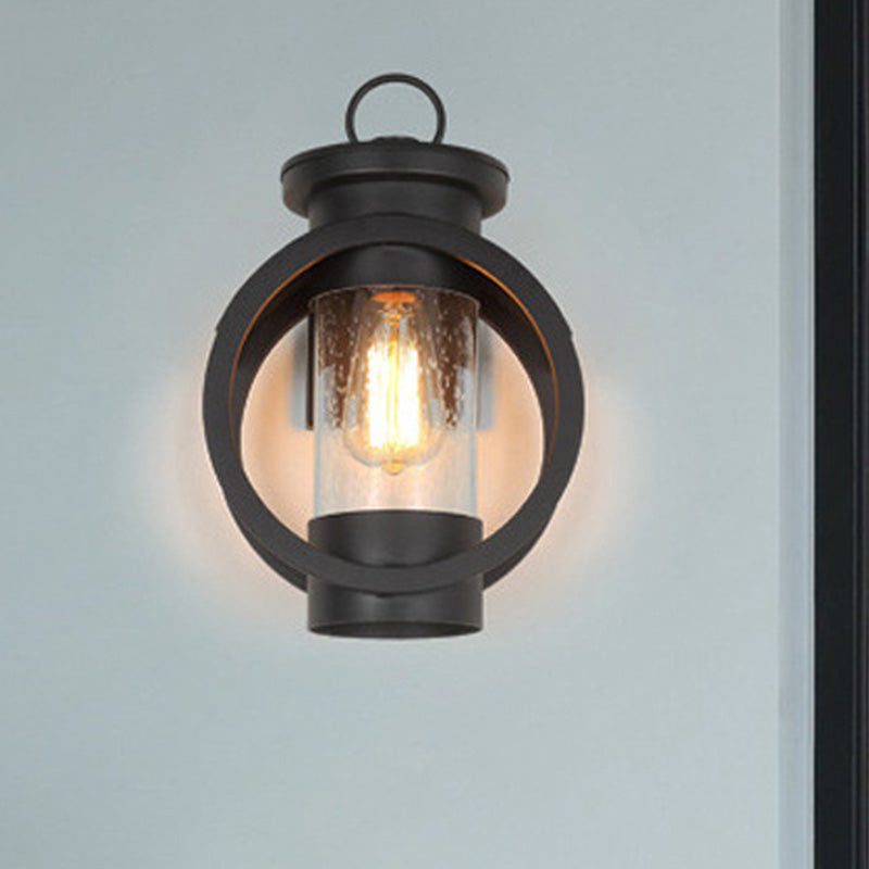 1 Light Cylinder Sconce Light Vintage Black Clear Seedy Glass Wall Lamp with Round Frame Clearhalo 'Art deco wall lights' 'Cast Iron' 'Glass' 'Industrial wall lights' 'Industrial' 'Middle century wall lights' 'Modern' 'Rustic wall lights' 'Tiffany' 'Traditional wall lights' 'Wall Lamps & Sconces' 'Wall Lights' Lighting' 438830