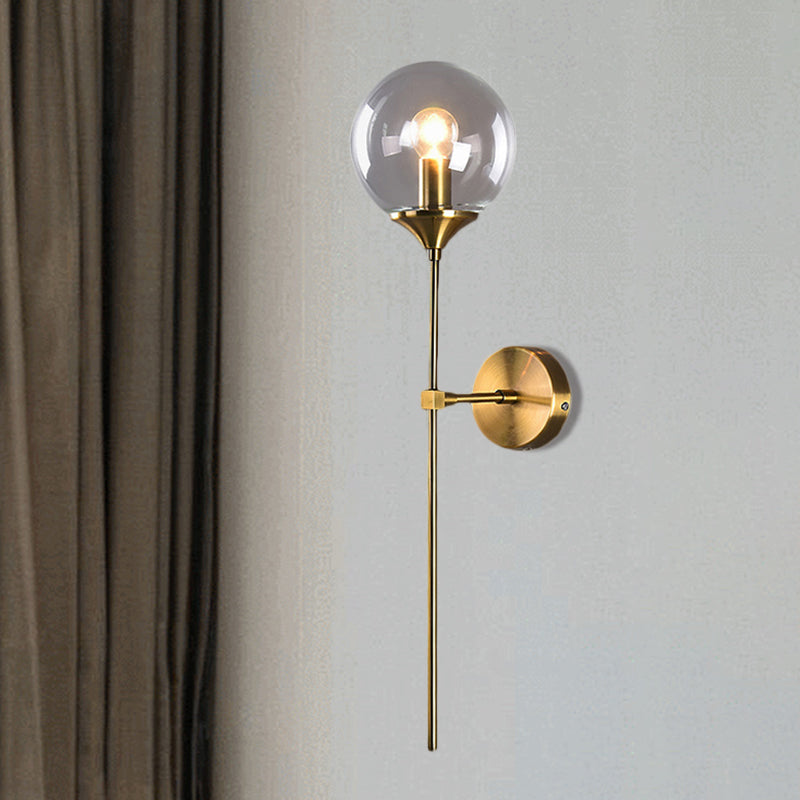 Modern Globe Shade Wall Lighting Single Bulb Clear/Grey/Amber Glass Sconce Light in Brass for Bedroom Clearhalo 'Art deco wall lights' 'Cast Iron' 'Glass' 'Industrial wall lights' 'Industrial' 'Middle century wall lights' 'Modern' 'Rustic wall lights' 'Tiffany' 'Traditional wall lights' 'Wall Lamps & Sconces' 'Wall Lights' Lighting' 460706