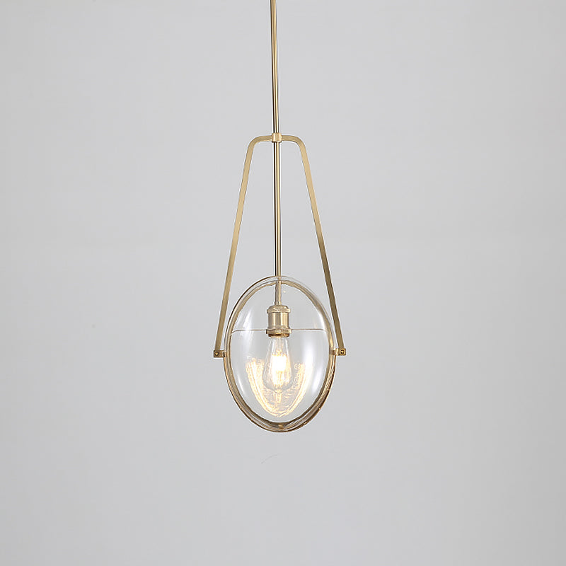 Brass Oval Pendant Light Contemporary 1-Light Clear Glass Ceiling Lamp with Forked Halberd Frame Clearhalo 'Ceiling Lights' 'Glass shade' 'Glass' 'Modern Pendants' 'Modern' 'Pendant Lights' 'Pendants' Lighting' 519921