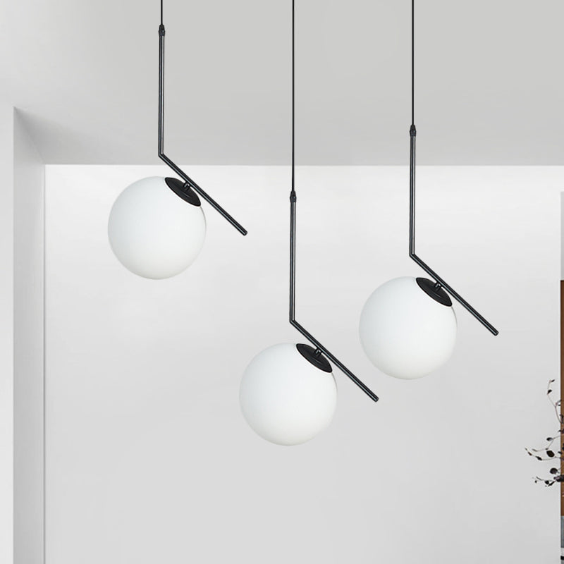 Cream Glass Orb Clster Pendant Light Modernism 3-Light Ceiling Lamp in Black with Angled Arm Clearhalo 'Ceiling Lights' 'Glass shade' 'Glass' 'Modern Pendants' 'Modern' 'Pendant Lights' 'Pendants' Lighting' 520133