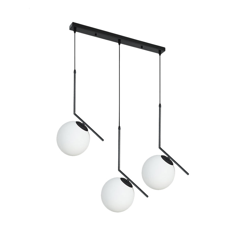 Cream Glass Orb Clster Pendant Light Modernism 3-Light Ceiling Lamp in Black with Angled Arm Clearhalo 'Ceiling Lights' 'Glass shade' 'Glass' 'Modern Pendants' 'Modern' 'Pendant Lights' 'Pendants' Lighting' 520134