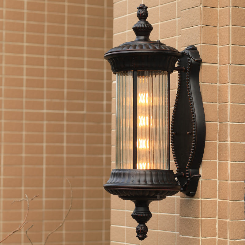 Black 1-Light Wall Sconce Lamp Country Clear Ribbed Glass Cylindrical Wall Lighting Ideas Black Clearhalo 'Wall Lamps & Sconces' 'Wall Lights' Lighting' 612301