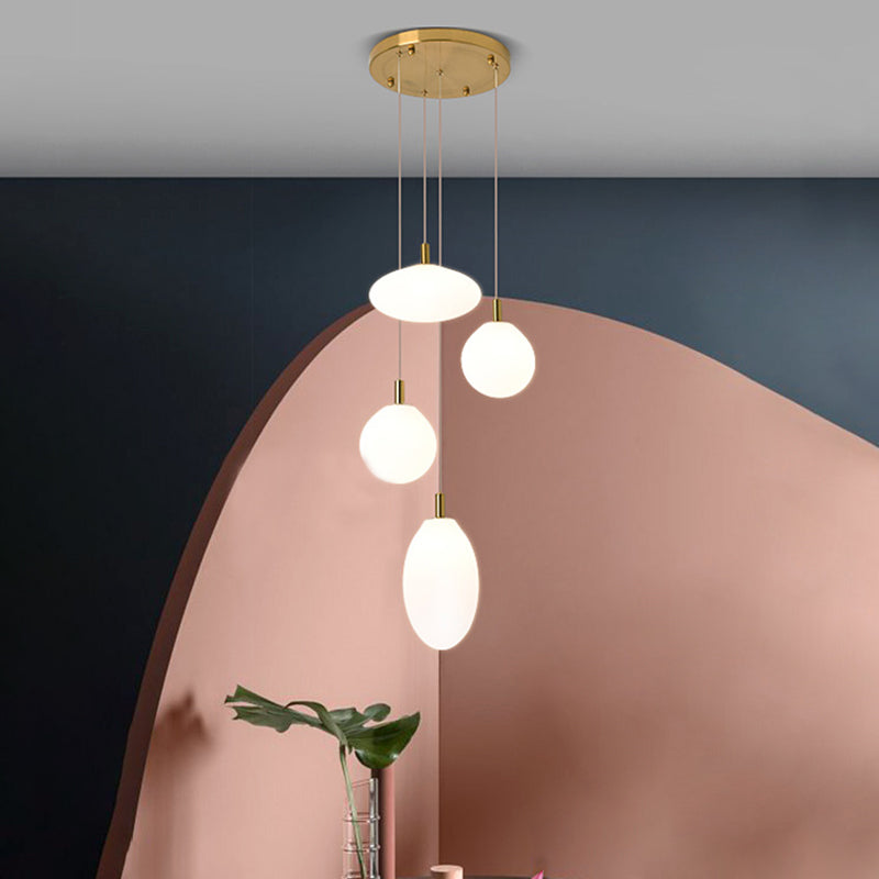 Gold/Black Ball and Oval Cluster Pendant Minimalism 4 Lights Cream Glass Hanging Lamp with Round Canopy Gold Clearhalo 'Ceiling Lights' 'Close To Ceiling Lights' 'Glass shade' 'Glass' 'Modern Pendants' 'Modern' 'Pendant Lights' 'Pendants' Lighting' 735545