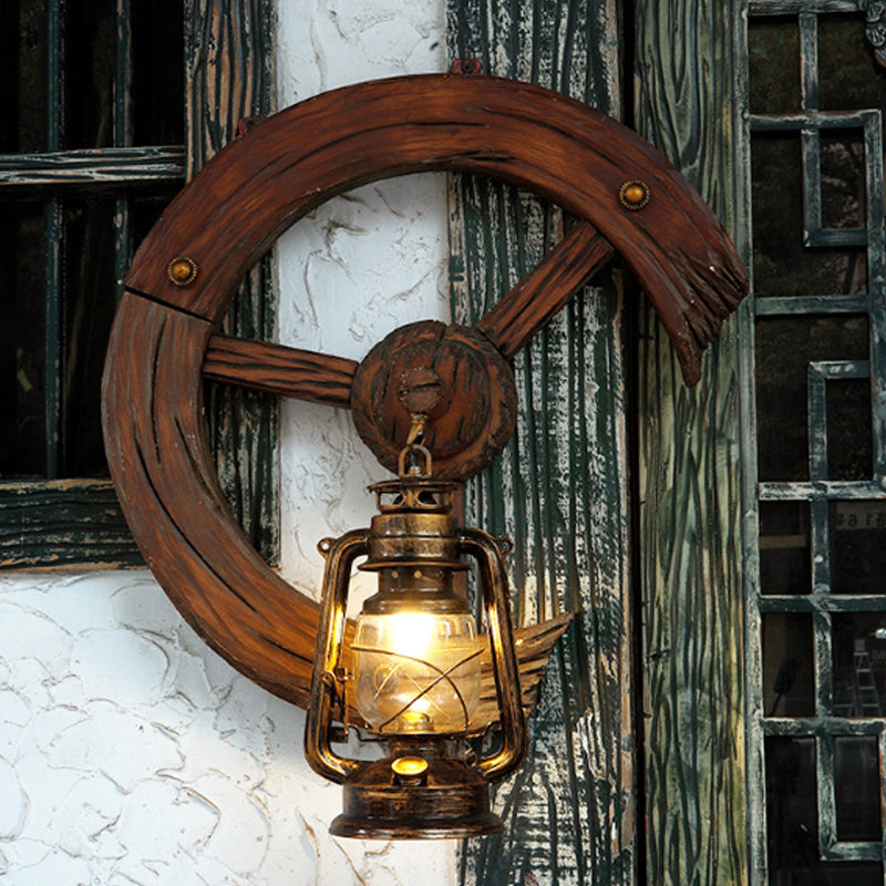 Clear Glass Kerosene Sconce Coastal 1 Light Bedroom Wall Mount Light Fixture in Brass with Wood Backplate Brass Clearhalo 'Art deco wall lights' 'Cast Iron' 'Glass' 'Industrial wall lights' 'Industrial' 'Middle century wall lights' 'Modern' 'Rustic wall lights' 'Tiffany' 'Traditional wall lights' 'Wall Lamps & Sconces' 'Wall Lights' Lighting' 736375