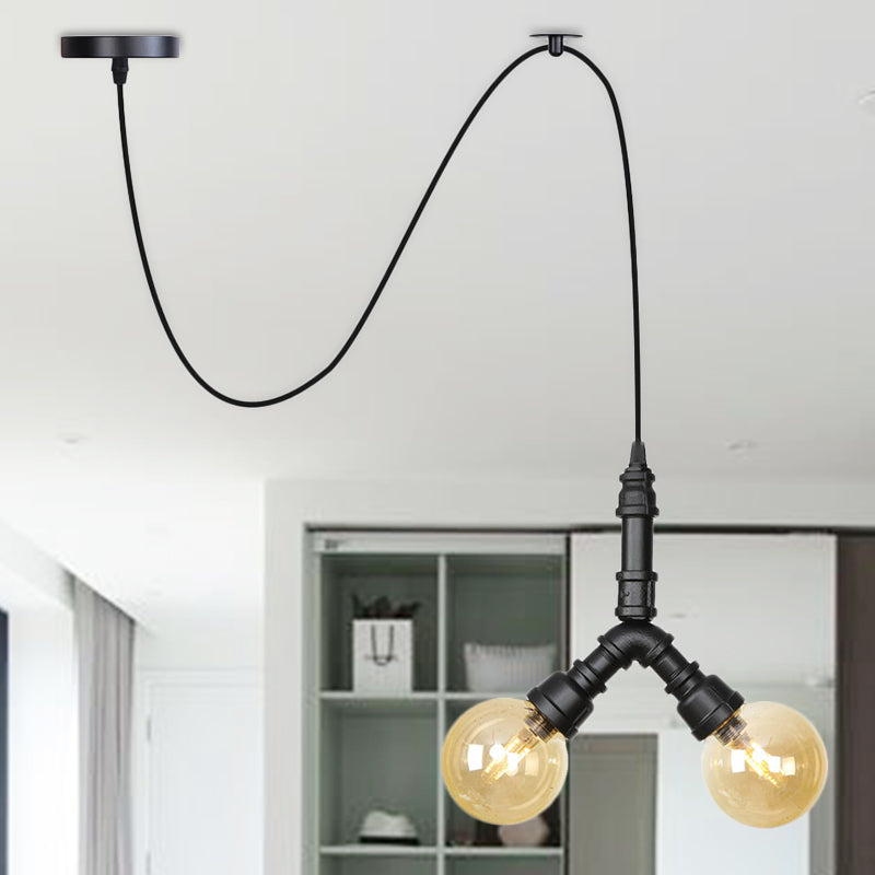 Amber Glass Black Pendant Chandelier Spherical/Capsule 2 Heads Antiqued Suspension Lamp with Swag Design Black B Clearhalo 'Ceiling Lights' 'Chandeliers' 'Glass shade' 'Glass' 'Industrial Chandeliers' 'Industrial' 'Middle Century Chandeliers' 'Pendant Lights' 'Tiffany' Lighting' 737514