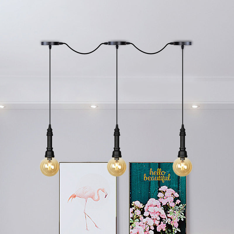 Amber Glass Ball Multiple Hanging Light Vintage 3/5/7-Light Coffee House Tandem LED Ceiling Pendant Lamp in Black 3 Black Clearhalo 'Ceiling Lights' 'Glass shade' 'Glass' 'Industrial Pendants' 'Industrial' 'Middle Century Pendants' 'Pendant Lights' 'Pendants' 'Tiffany' Lighting' 738882