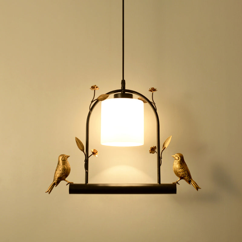 Birdcage Ceiling Light Modernist Metal 1-Head Black and Gold Hanging Pendant with Cylinder Cream Glass Shade and Bird Decor Clearhalo 'Ceiling Lights' 'Close To Ceiling Lights' 'Glass shade' 'Glass' 'Modern Pendants' 'Modern' 'Pendant Lights' 'Pendants' Lighting' 757102